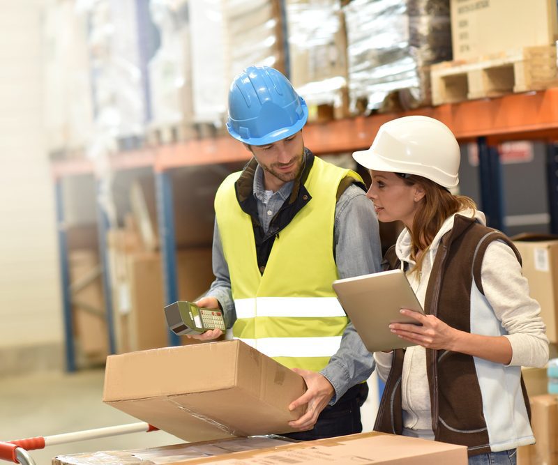 Warehouse Managers Checking Stock Levels